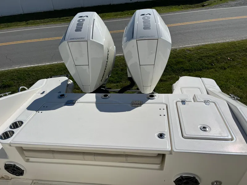 Slide: The Image of 2025 Boston Whaler 280 Dauntless with dual outboard engines, viewed from the rear deck. - 22