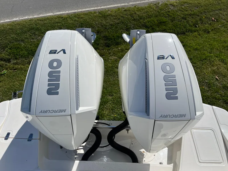 Slide: The Image of Twin Mercury V8 outboard engines on a 2025 Boston Whaler 280 Dauntless boat. - 24