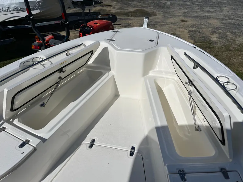 Slide: The Image of 2025 Boston Whaler 280 Dauntless boat interior with open storage compartments. - 27