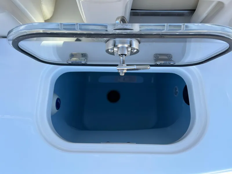 Slide: The Image of Open storage compartment on a 2025 Boston Whaler 250 Outrage boat. - 15