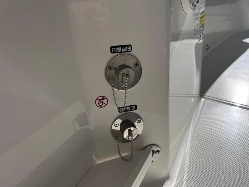 Slide: The Image of Fresh and raw water inlets on 2025 Boston Whaler 250 Outrage boat. - 16