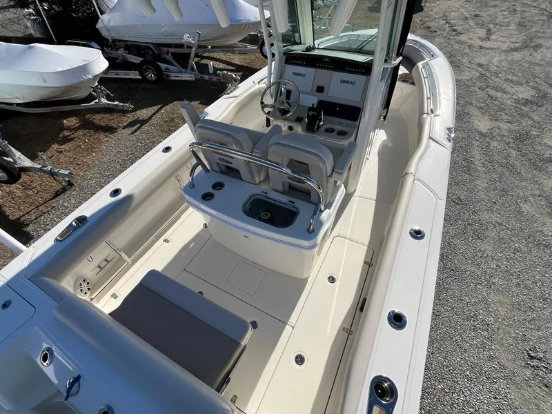 Slide: The Image of 2025 Boston Whaler 250 Outrage boat interior with helm and seating area. - 4