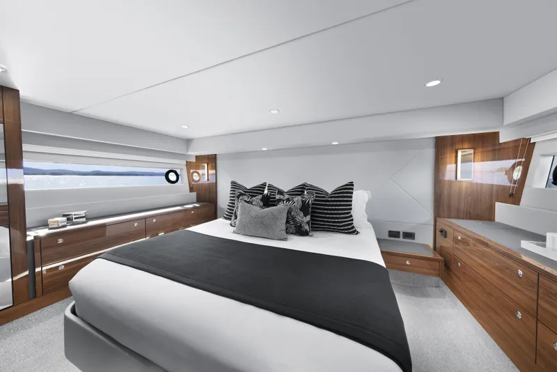 Slide: The Image of Luxurious Maritimo M600 2026 yacht bedroom with modern design and elegant wood accents. - 13