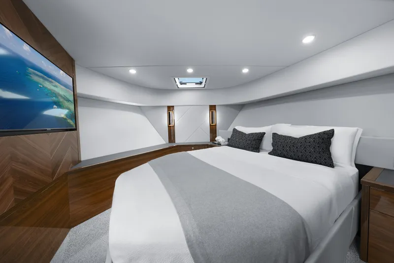 Slide: The Image of Luxurious bedroom interior of 2026 Maritimo M600 yacht with modern design and large screen TV. - 15