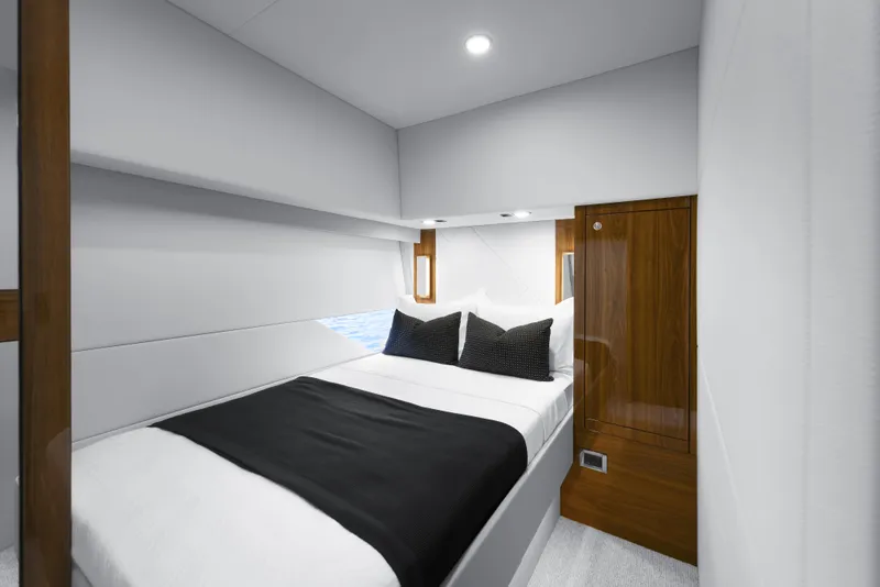 Slide: The Image of Luxurious cabin interior of 2026 Maritimo M600 yacht with modern bedding and wooden accents. - 16