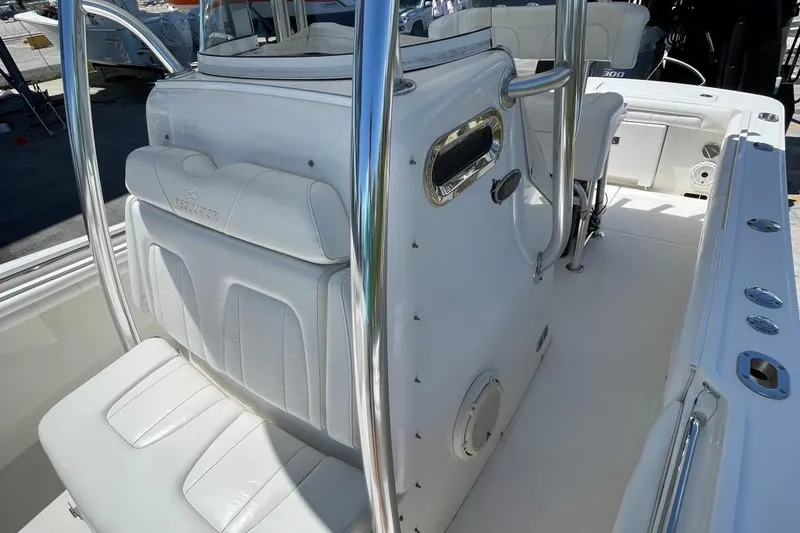 Slide: The Image of 2017 Regulator R23 boat interior with white seating and stainless steel railings. - 14
