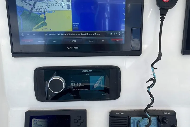 Slide: The Image of Control panel of a 2017 Regulator R23 boat with Garmin and Fusion electronics. - 22