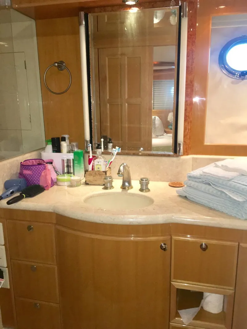 Slide: The Image of Luxurious bathroom in a 2004 McKinna 58 yacht with modern amenities and elegant design. - 12