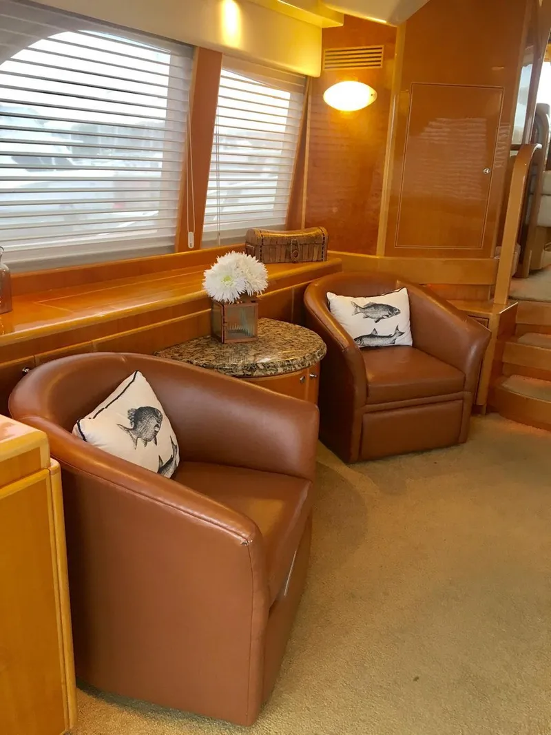 Slide: The Image of Luxurious 2004 McKinna 58 yacht interior with leather chairs and elegant decor. - 3