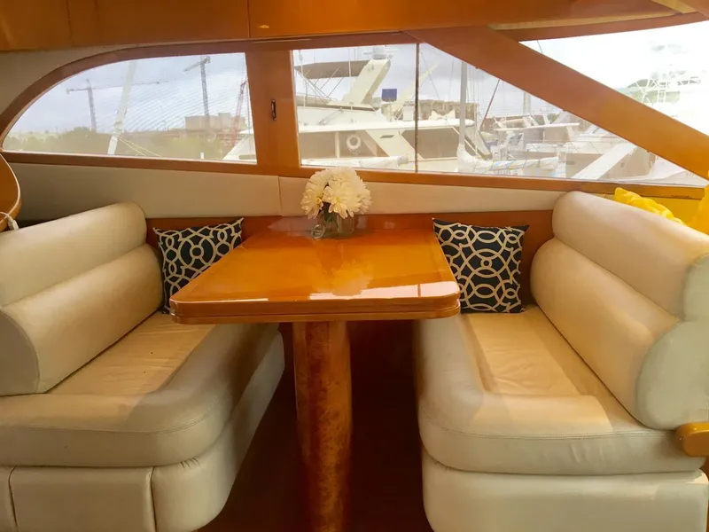 Slide: The Image of Luxurious 2004 McKinna 58 yacht interior with elegant dining area and plush seating. - 6