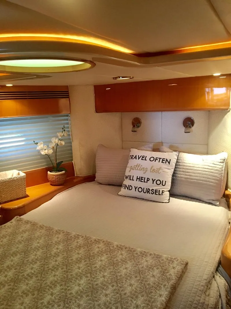 Slide: The Image of Luxurious bedroom in a 2004 McKinna 58 yacht with elegant decor and cozy bedding. - 8