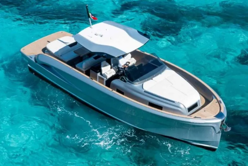 Slide: The Image of 2024 Solaris Power 40 Open luxury yacht cruising on clear blue water. - 0
