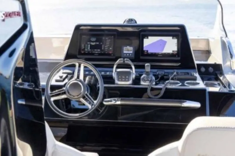 Slide: The Image of Modern cockpit of 2024 Solaris Power 40 Open yacht with advanced navigation systems. - 2
