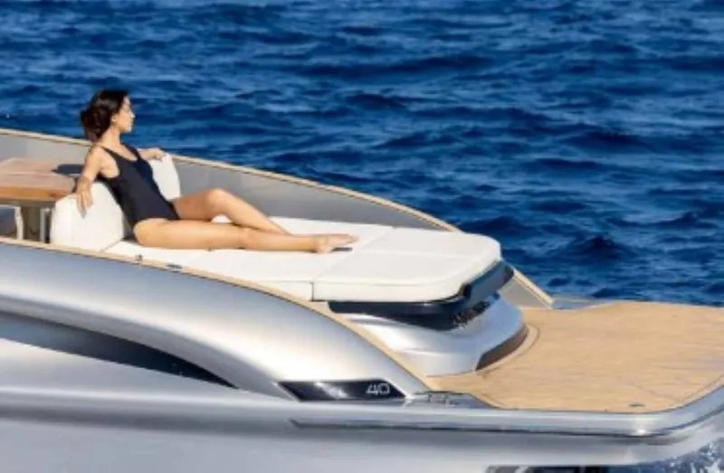 Slide: The Image of 2024 Solaris Power 40 Open yacht with woman sunbathing on deck. - 6
