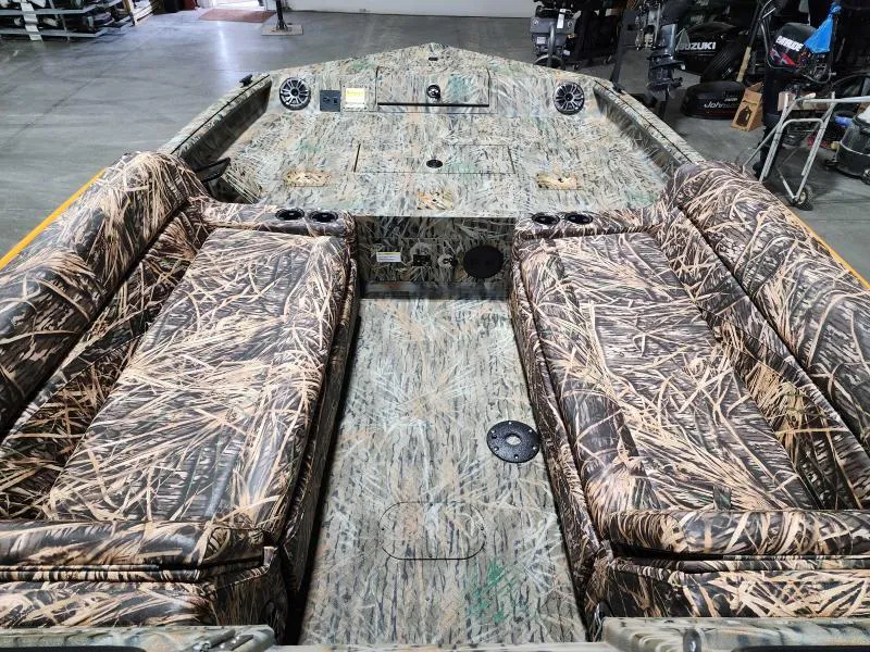 Slide: The Image of 2024 SeaArk EasyCat boat interior with camouflage seating and spacious layout. - 4