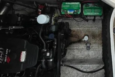 Slide: The Image of 2005 Chaparral 2300 boat engine compartment with batteries and MerCruiser engine. - 11