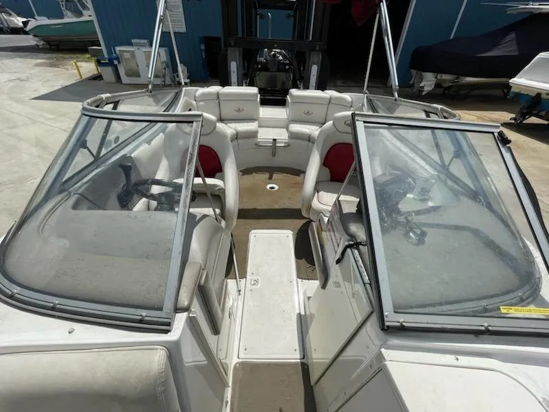 Slide: The Image of 2005 Chaparral 2300 boat interior with seating and windshield. - 3