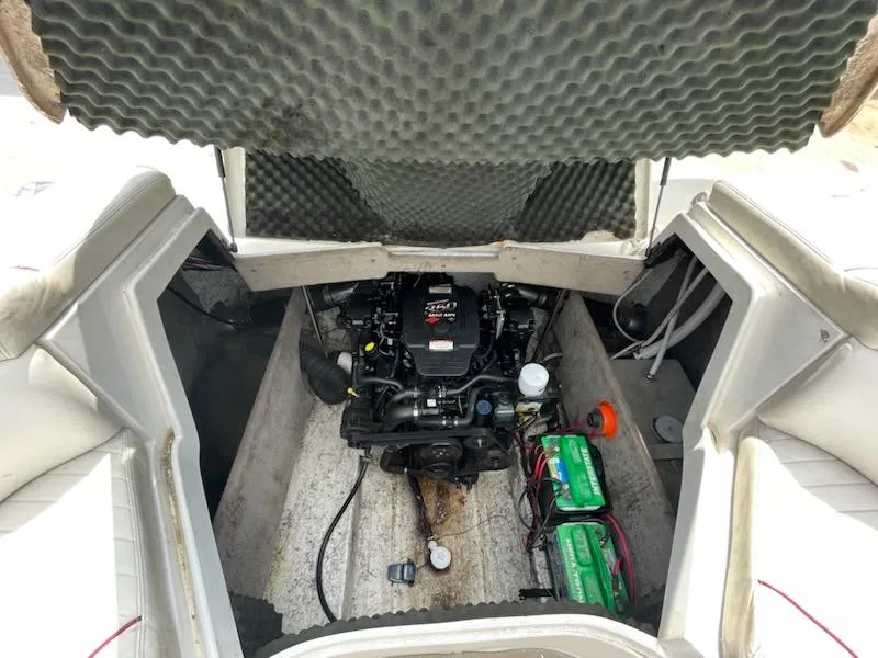 Slide: The Image of 2005 Chaparral 2300 boat engine compartment with batteries and wiring. - 5