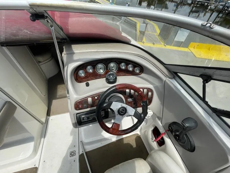 Slide: The Image of 2005 Chaparral 2300 boat dashboard with steering wheel and instrument panel. - 7