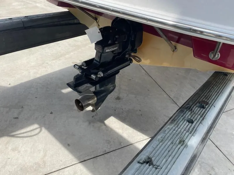 Slide: The Image of 2005 Chaparral 2300 boat stern with MerCruiser outdrive on trailer. - 9