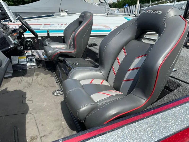 Slide: The Image of 2022 Nitro Z20 Pro boat interior with gray and red seats. - 10