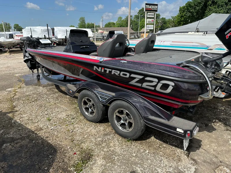 Slide: The Image of 2022 Nitro Z20 Pro bass boat on a trailer in a dealership lot. - 13