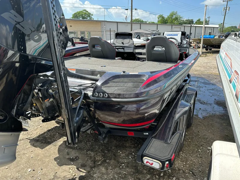 Slide: The Image of 2022 Nitro Z20 Pro bass boat with dual seats and powerful outboard motor. - 15