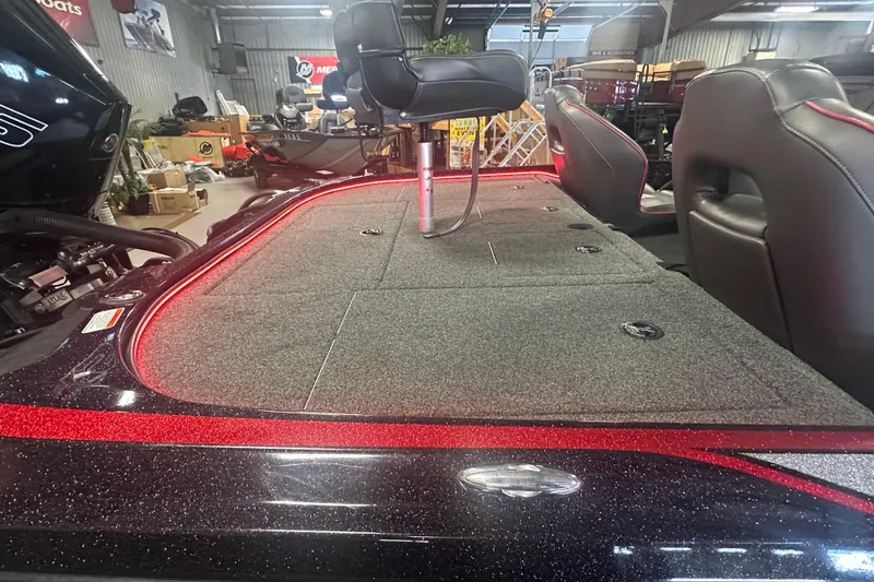 Slide: The Image of 2022 Nitro Z20 Pro boat interior with seating and storage compartments in showroom. - 23