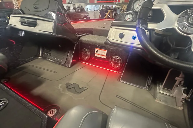 Slide: The Image of Interior of 2022 Nitro Z20 Pro boat with red LED lighting and modern dashboard. - 24