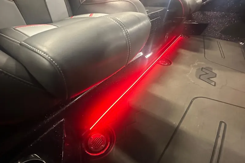 Slide: The Image of Interior of 2022 Nitro Z20 Pro with red LED lighting and leather seats. - 25
