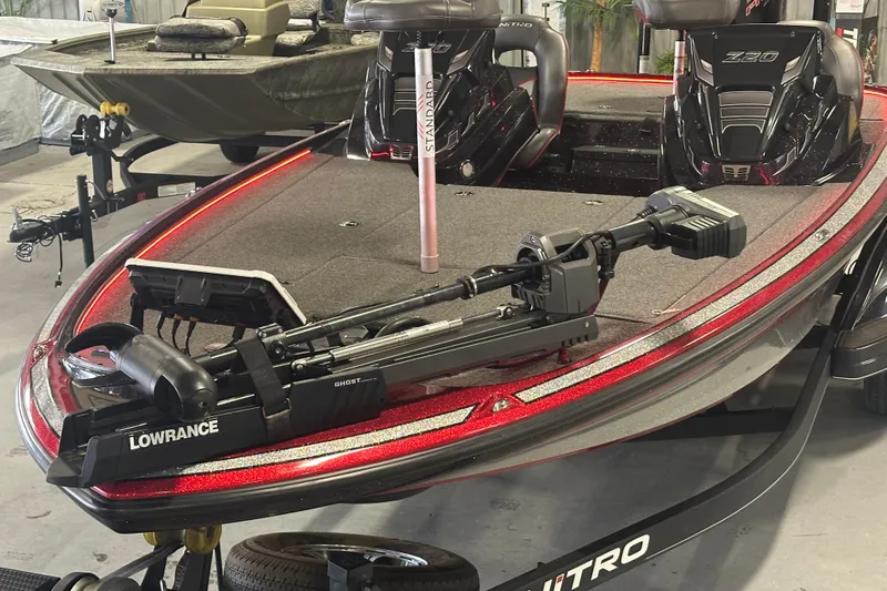 Slide: The Image of 2022 Nitro Z20 Pro boat with Lowrance Ghost trolling motor, featuring sleek red design. - 27