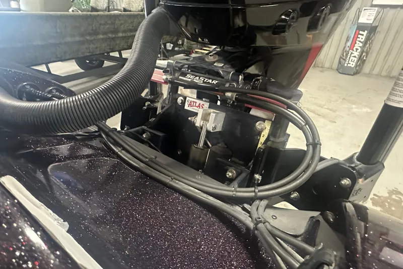Slide: The Image of Close-up of a 2022 Nitro Z20 Pro boat engine with visible cables and components. - 30