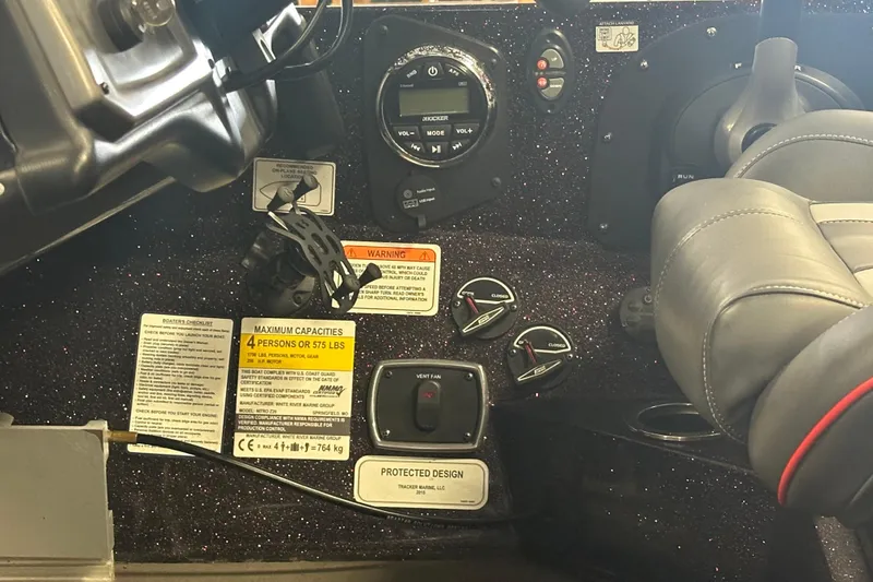 Slide: The Image of Dashboard of a 2022 Nitro Z20 Pro boat with controls and capacity warnings. - 31