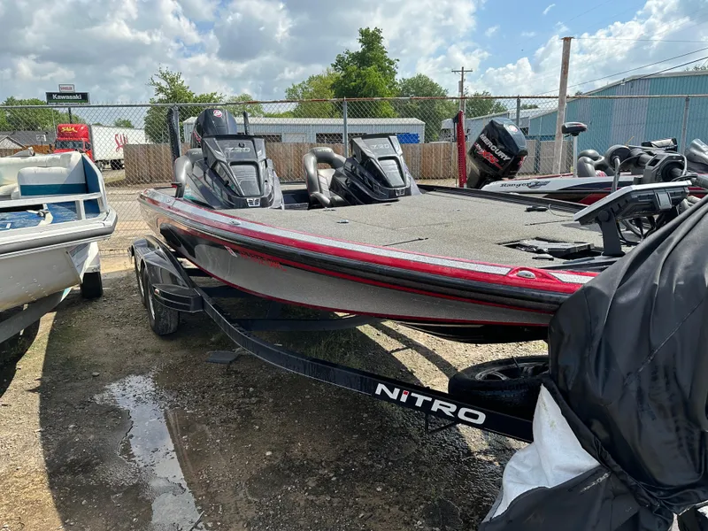 Slide: The Image of 2022 Nitro Z20 Pro bass boat in a boatyard, red and black design. - 5