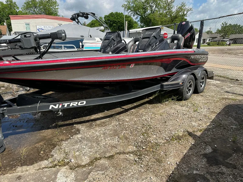 Slide: The Image of 2022 Nitro Z20 Pro fishing boat on a trailer in a parking lot. - 6