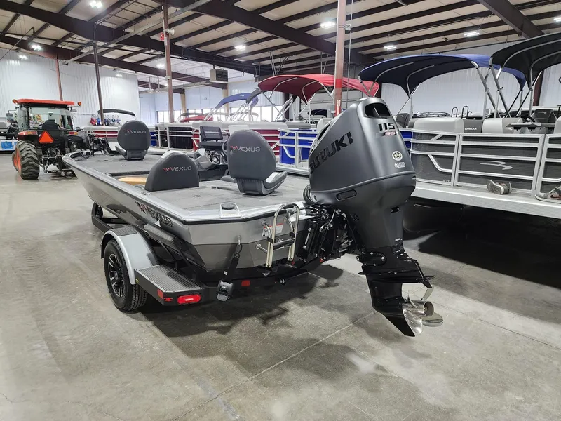 Slide: The Image of 2024 Vexus AVX1880 boat with Suzuki outboard motor in showroom. - 10