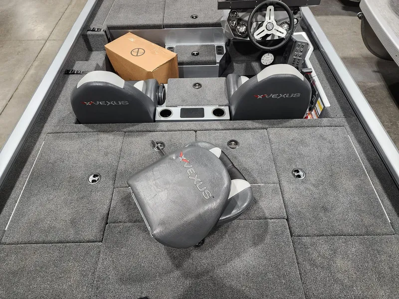 Slide: The Image of 2024 Vexus AVX1880 boat interior with gray seats and steering wheel. - 4