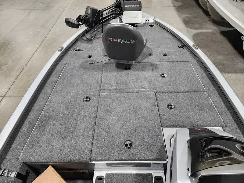 Slide: The Image of 2024 Vexus AVX1880 fishing boat deck with storage compartments and seating. - 5