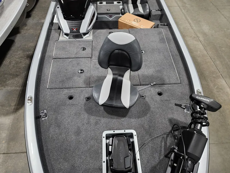 Slide: The Image of 2024 Vexus AVX1880 fishing boat interior with seating and Garmin equipment. - 7
