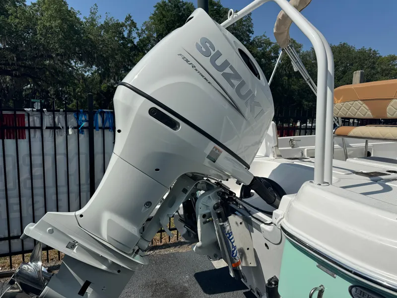 Slide: The Image of 2024 NauticStar 211 Hybrid boat with Suzuki outboard motor. - 11