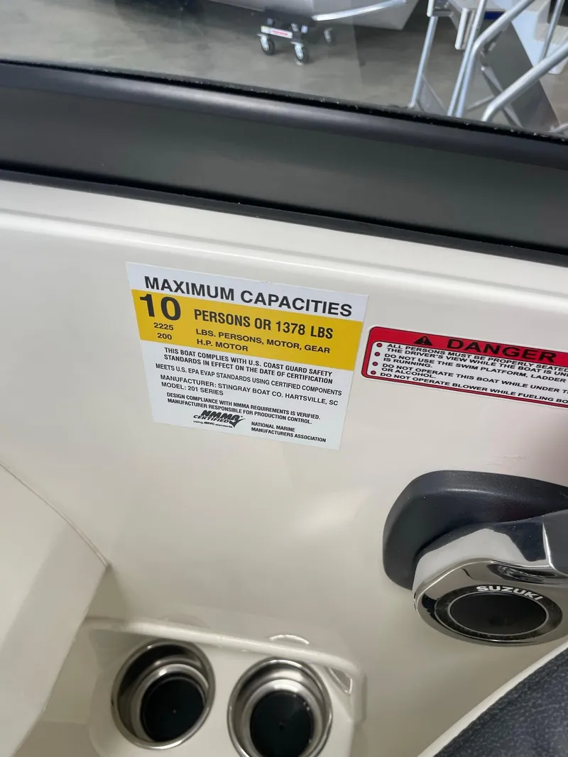 Slide: The Image of 2024 Stingray 201 DC boat capacity label, max 10 persons or 1378 lbs. - 7