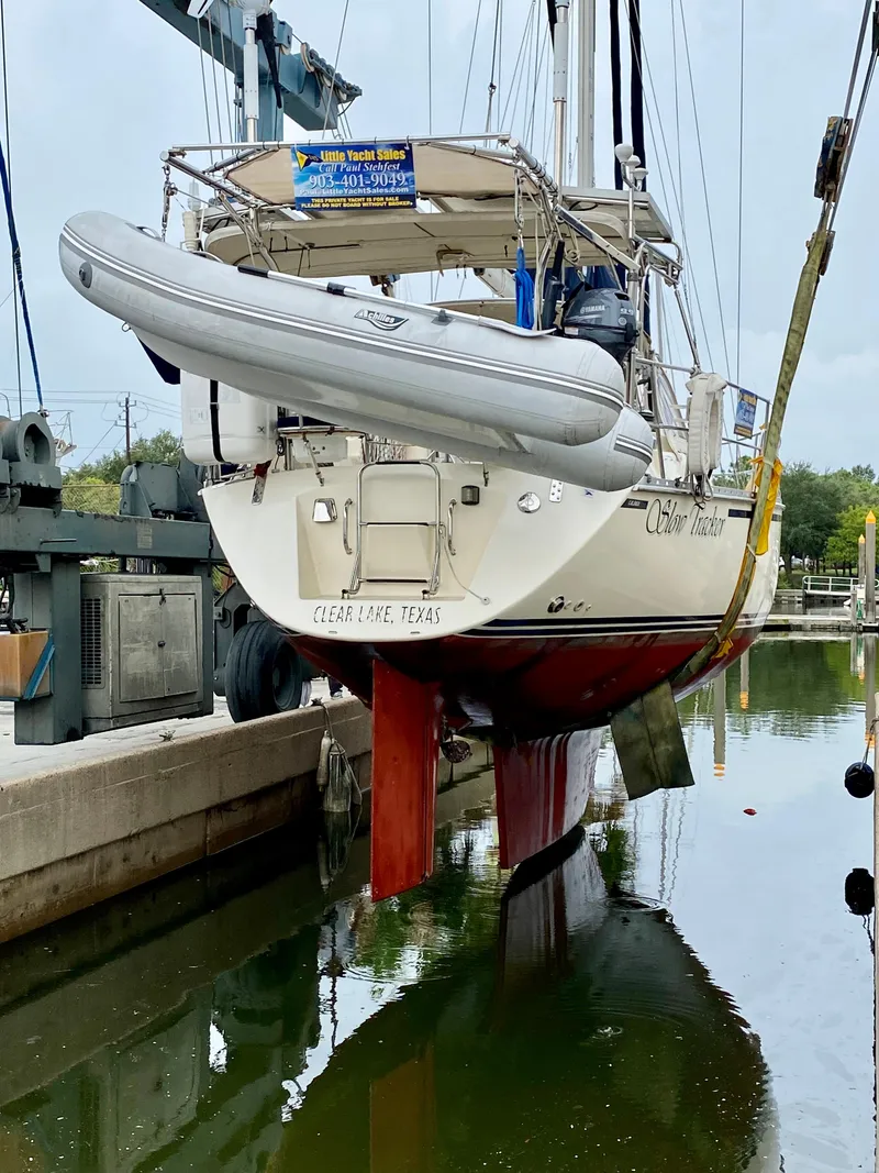 Slide: The Image of 2005 Caliber 40 LRC SE sailboat in dry dock with dinghy attached. - 23