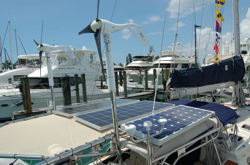 Slide: The Image of 2005 Caliber 40 LRC SE sailboat with solar panels and wind turbine in marina. - 36