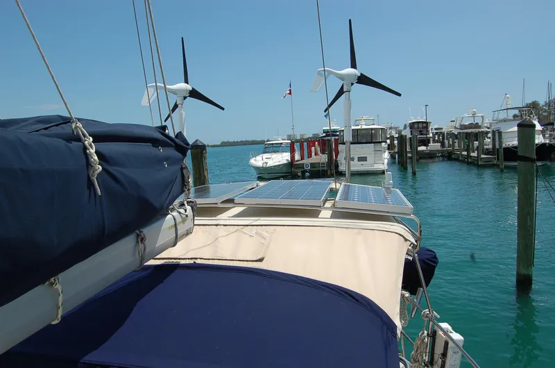 Slide: The Image of Sailboat docked with solar panels and wind turbines, Caliber 40 LRC SE, 2005 model. - 37