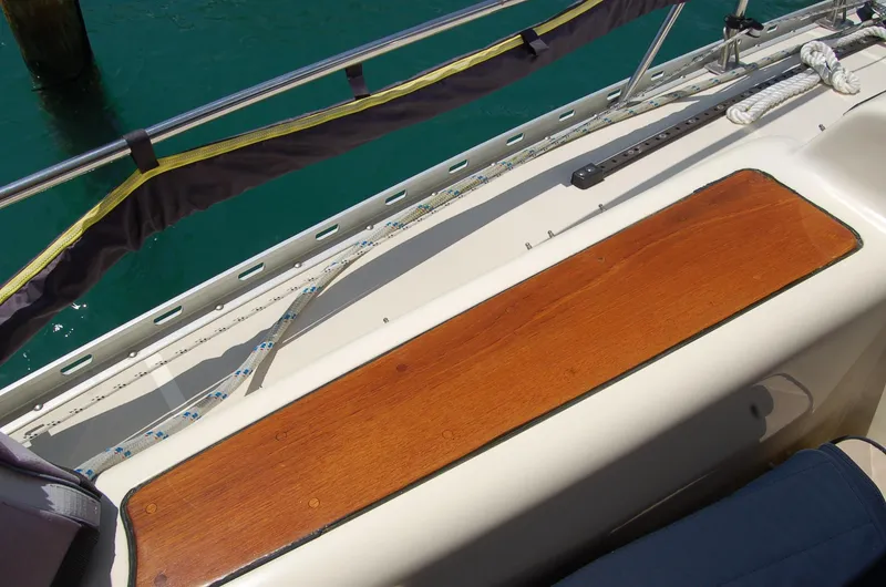 Slide: The Image of Deck of 2005 Caliber 40 LRC SE sailboat with wooden trim and railing. - 41