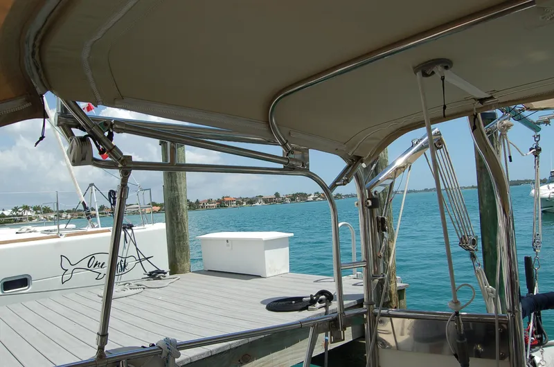 Slide: The Image of 2005 Caliber 40 LRC SE sailboat docked at a marina with clear blue water. - 43