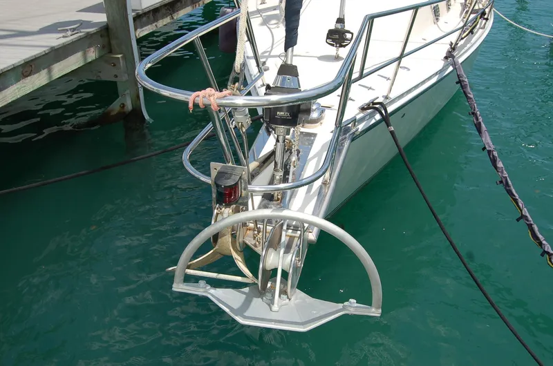 Slide: The Image of Bow of 2005 Caliber 40 LRC SE sailboat with anchor, docked in clear water. - 8