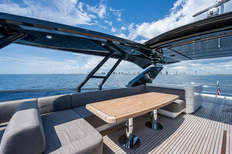 Slide: The Image of 2017 Monte Carlo Yachts MCY 80 Flybridge, luxurious outdoor seating area with ocean view. - 15