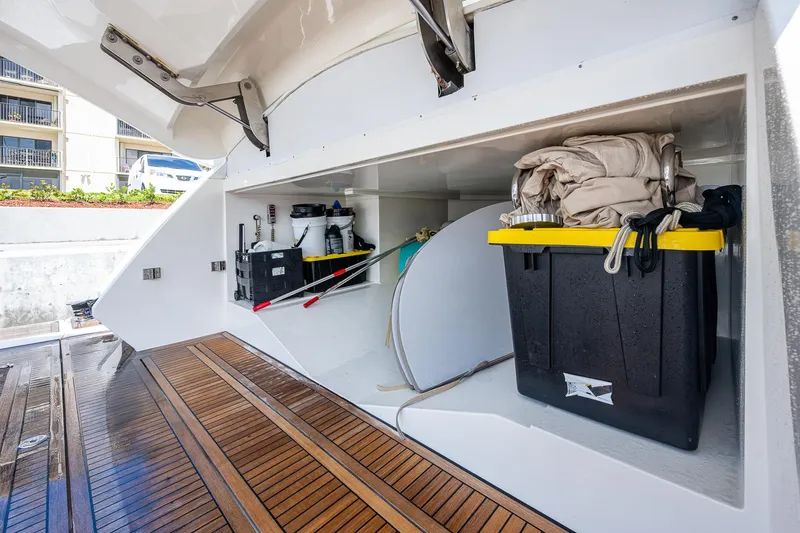 Slide: The Image of Storage compartment on 2017 Monte Carlo Yachts MCY 80 Flybridge with equipment and supplies. - 24
