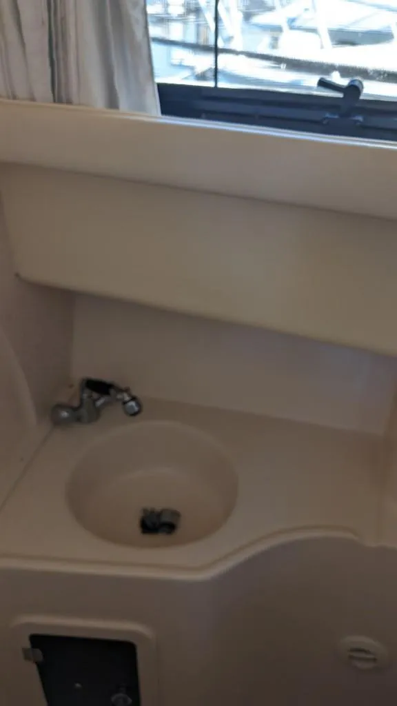 Slide: The Image of 2006 Grady-White Marlin 300 boat interior sink area. - 16